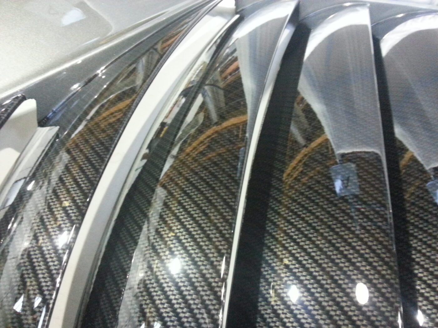 Car various elements coated in carbon fibre hydrographic film painted black