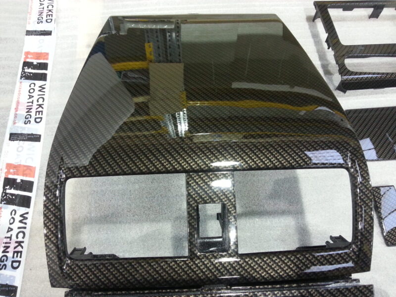 Car interior various elements coated in carbon fibre hydrographic film painted black