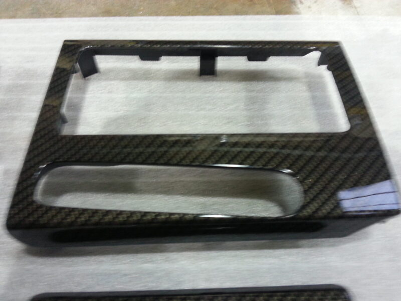 Car interior various elements coated in carbon fibre hydrographic film painted black