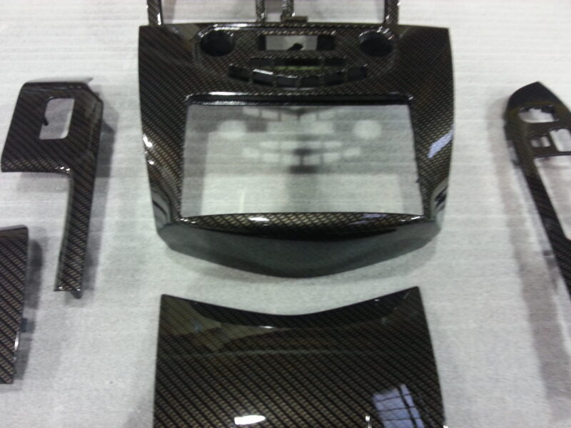 Car interior various elements coated in carbon fibre hydrographic film painted black