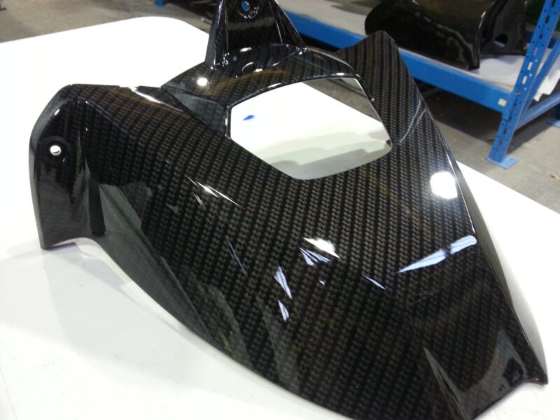 Motorbike parts coated in carbon fibre hydrographic film painted black
