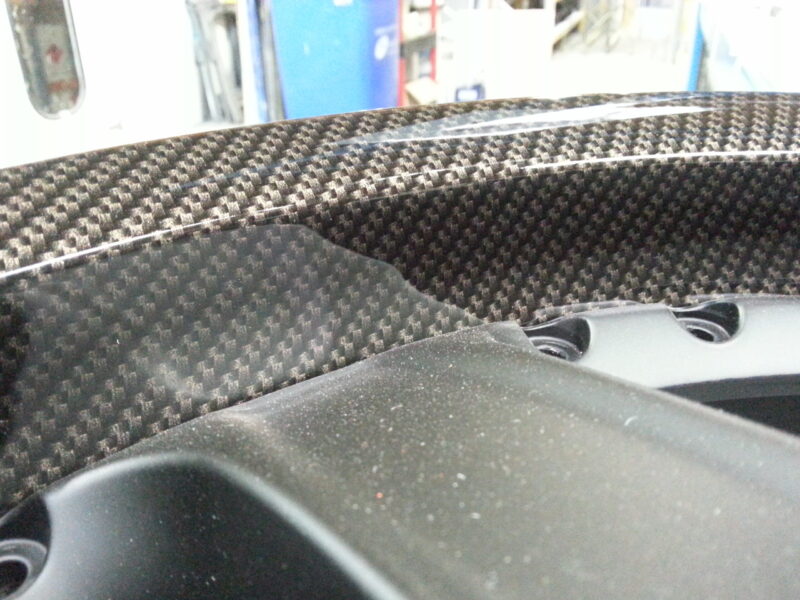 Car alloy wheels coated in carbon fibre hydrographic film painted black