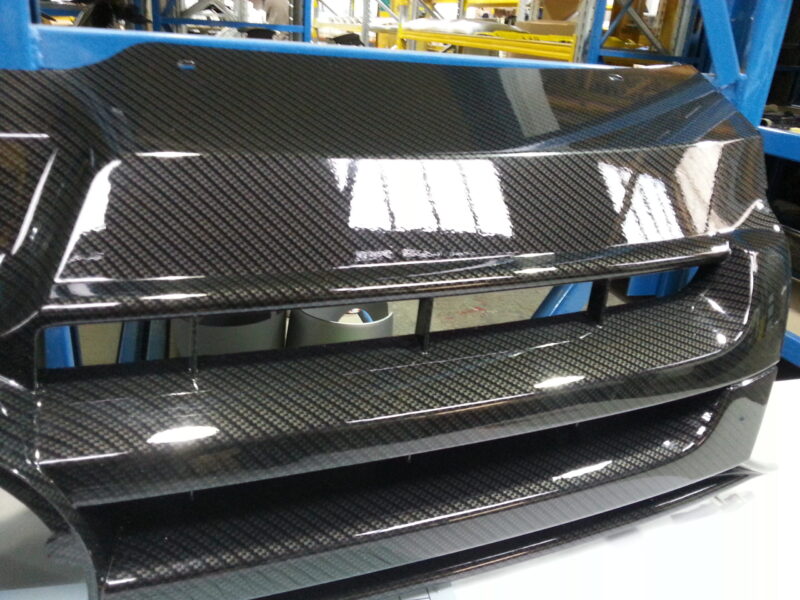 VW radiator grill coated in carbon fibre hydrographic film painted black