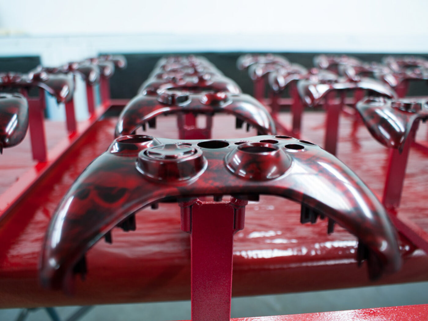 Gamepad coated in skull hydrographic film painted red
