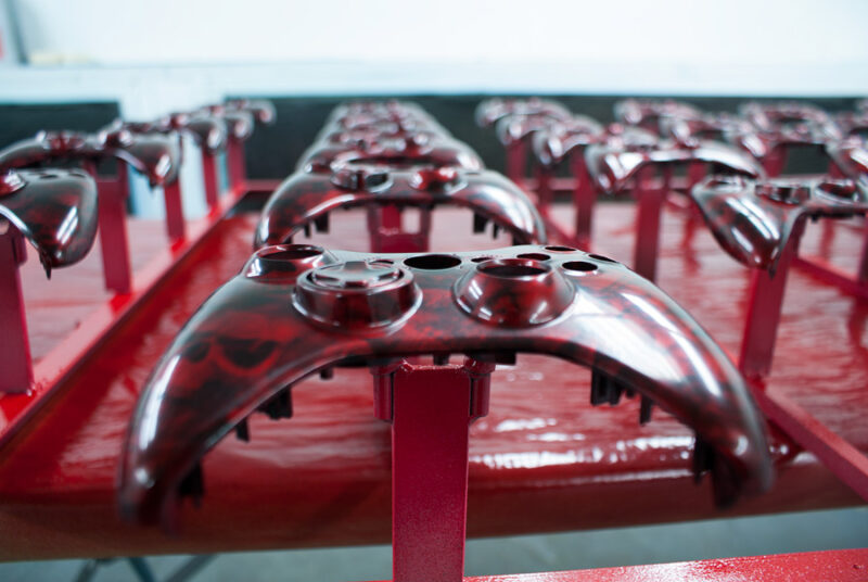 Gamepad coated in skull hydrographic film painted red