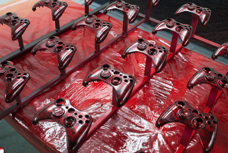 Gamepad coated in skull hydrographic film painted red