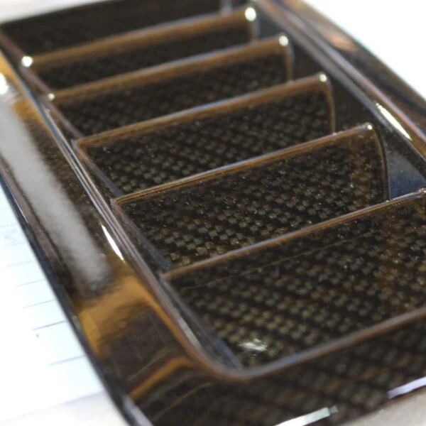 Car exterior element coated in carbon fibre hydrographic film painted black