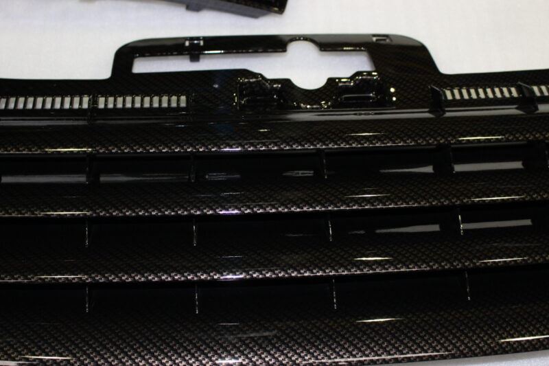 VW exterior elements coated in carbon fibre hydrographic film painted black