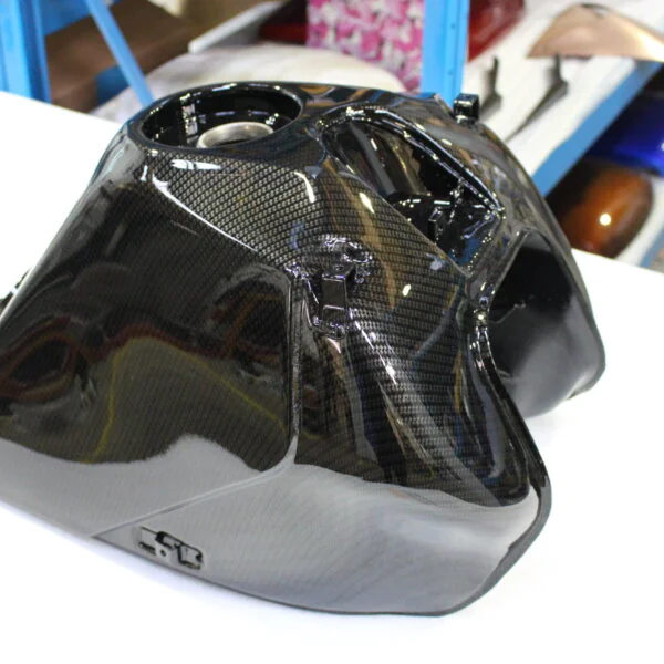 Motorbike tank coated in carbon fibre hydrographic film painted black