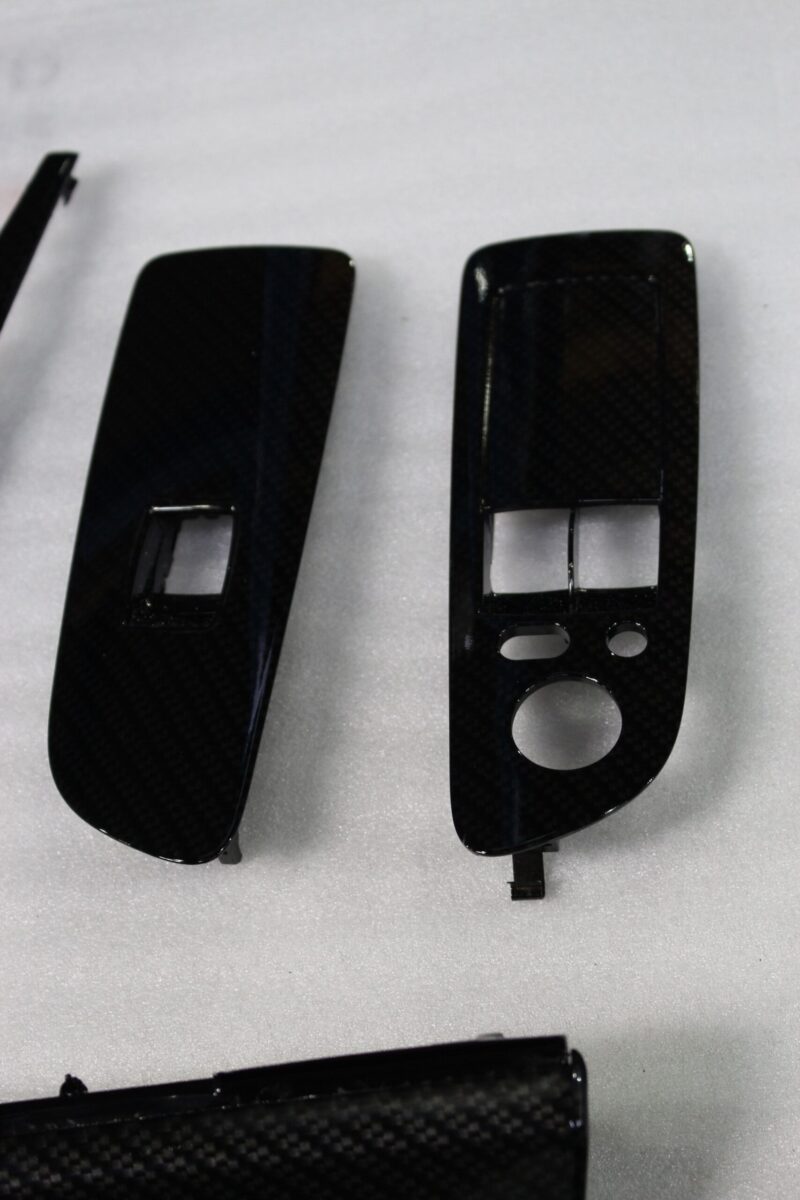 Car interior various elements coated in carbon fibre hydrographic film painted black