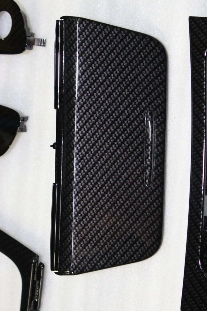 Car interior various elements coated in carbon fibre hydrographic film painted black
