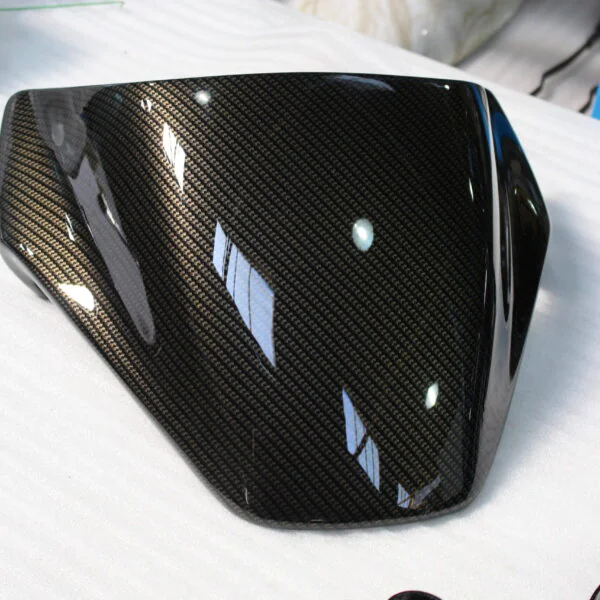 Motorbike parts coated in carbon fibre hydrographic film painted black