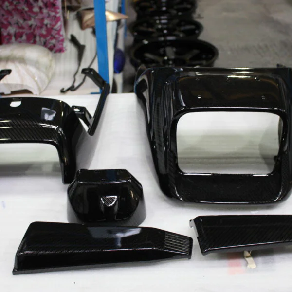 Classic Motorbike parts coated in carbon fibre hydrographic film painted black