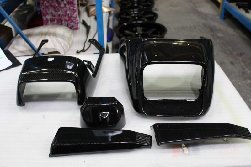 Classic Motorbike parts coated in carbon fibre hydrographic film painted black