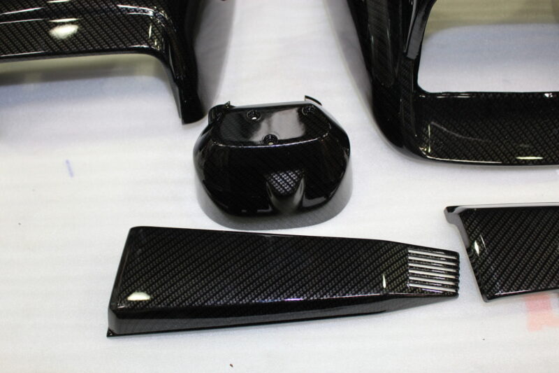 Classic Motorbike parts coated in carbon fibre hydrographic film painted black