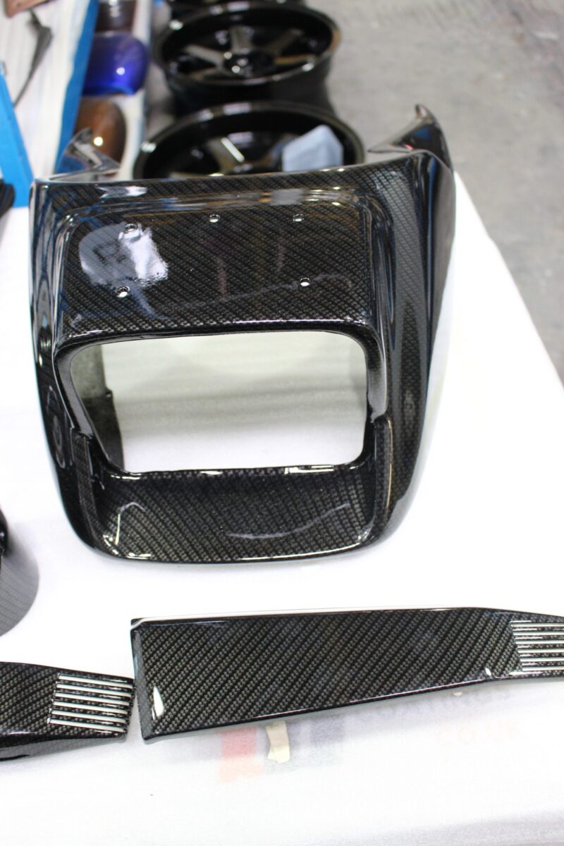 Classic Motorbike parts coated in carbon fibre hydrographic film painted black
