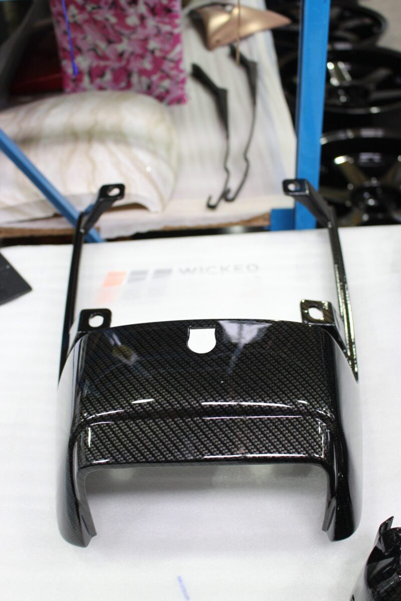 Classic Motorbike parts coated in carbon fibre hydrographic film painted black
