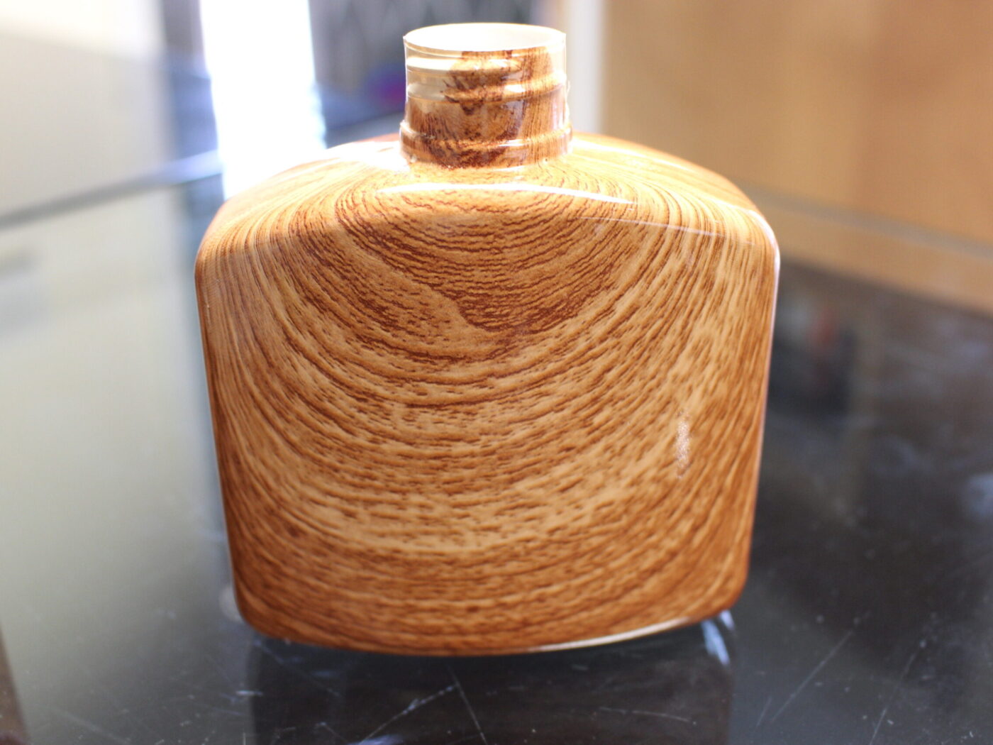 Hip flask coated in wood hydrographic film