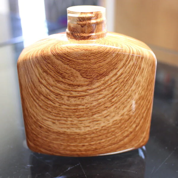 Hip flask coated in wood hydrographic film