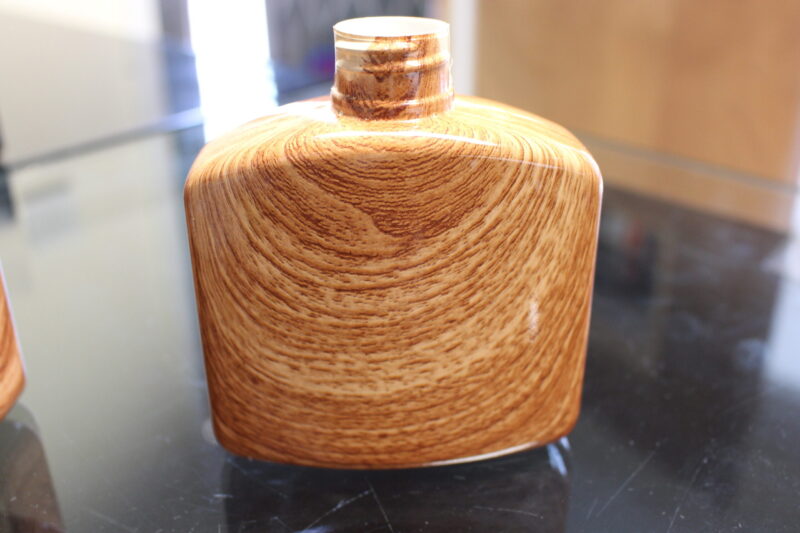 Hip flask coated in wood hydrographic film