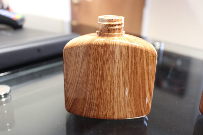 Hip flask coated in wood hydrographic film