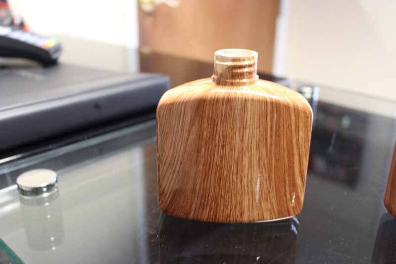 Hip flask coated in wood hydrographic film