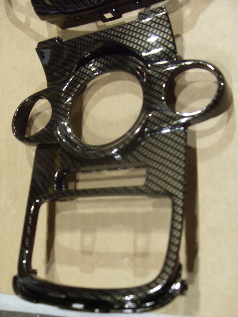 Car interior various elements coated in carbon fibre hydrographic film