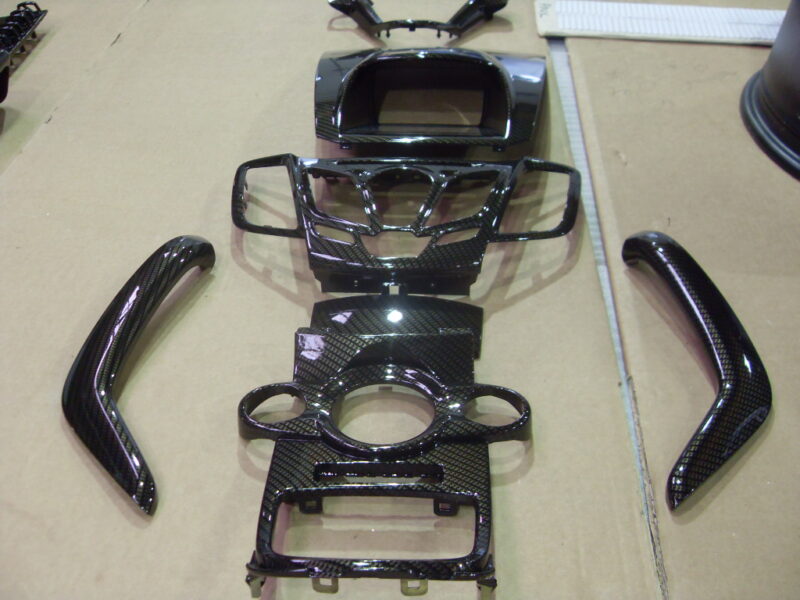 Car interior various elements coated in carbon fibre hydrographic film