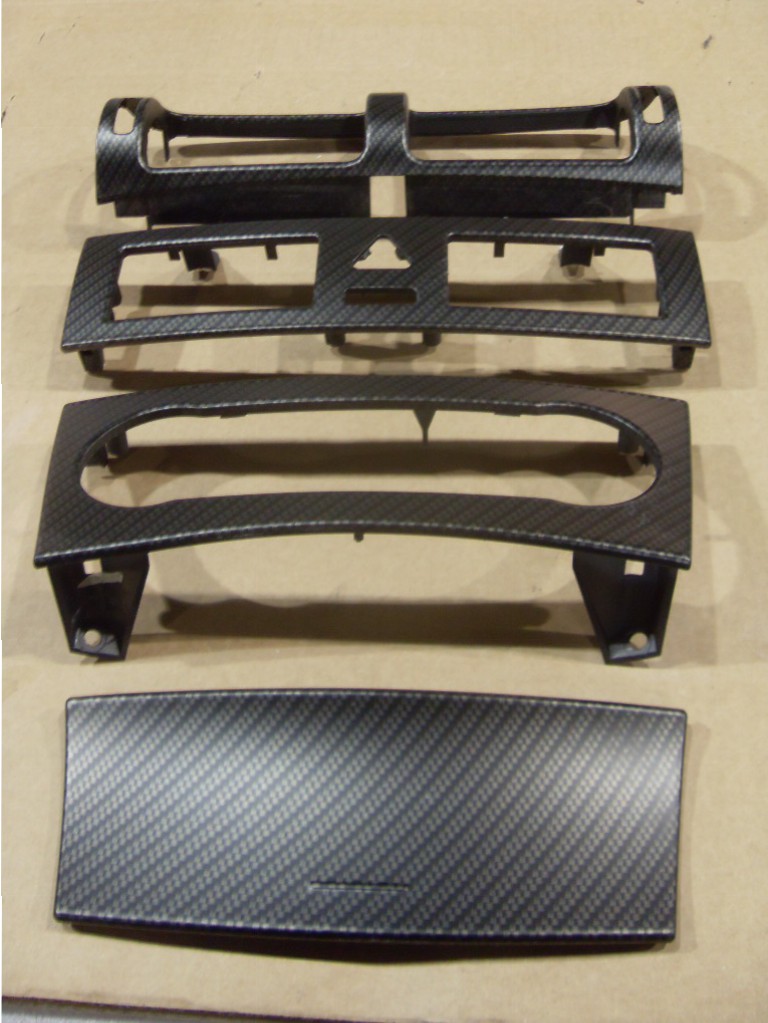 Car dashboard elements coated in carbon fibre hydrographic film painted black