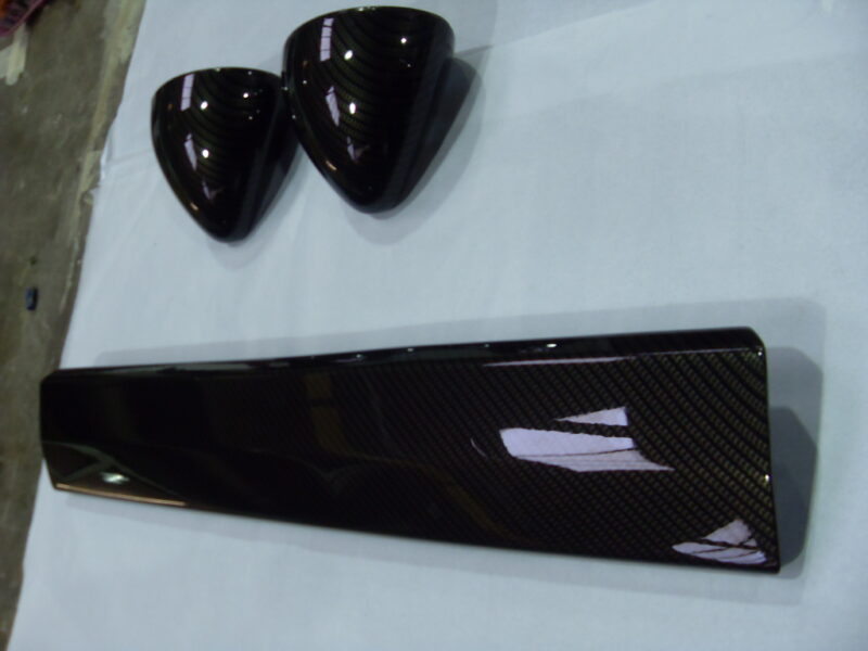 Motorbike various elements coated in carbon fibre hydrographic film painted black