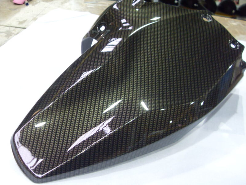 Motorbike various elements coated in carbon fibre hydrographic film painted black