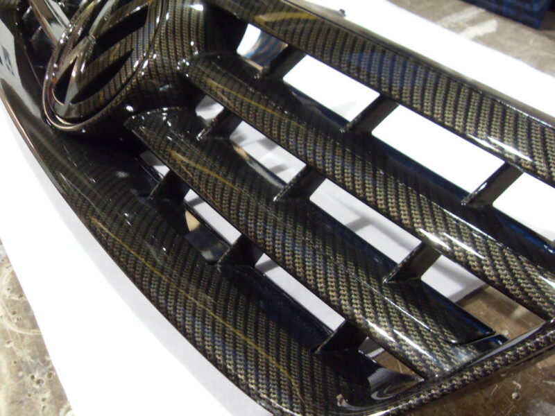 VW radiator cover coated in carbon fibre hydrographic film painted black