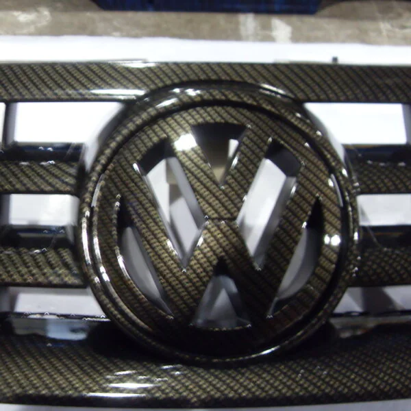 VW radiator cover coated in carbon fibre hydrographic film painted black