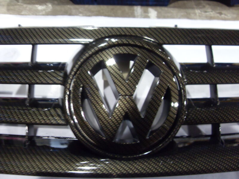 VW radiator cover coated in carbon fibre hydrographic film painted black