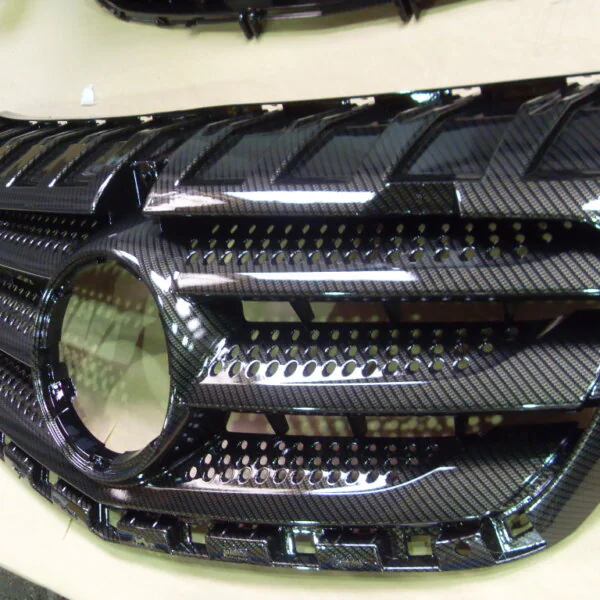 Mercedes radiator cover coated in carbon fibre hydrographic film painted black