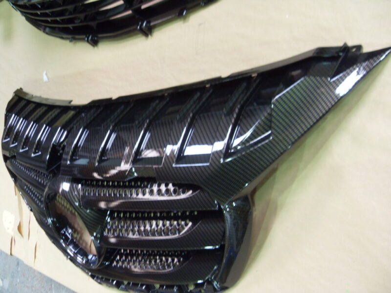 Mercedes radiator cover coated in carbon fibre hydrographic film painted black