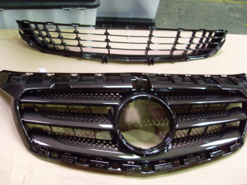 Mercedes radiator cover coated in carbon fibre hydrographic film painted black