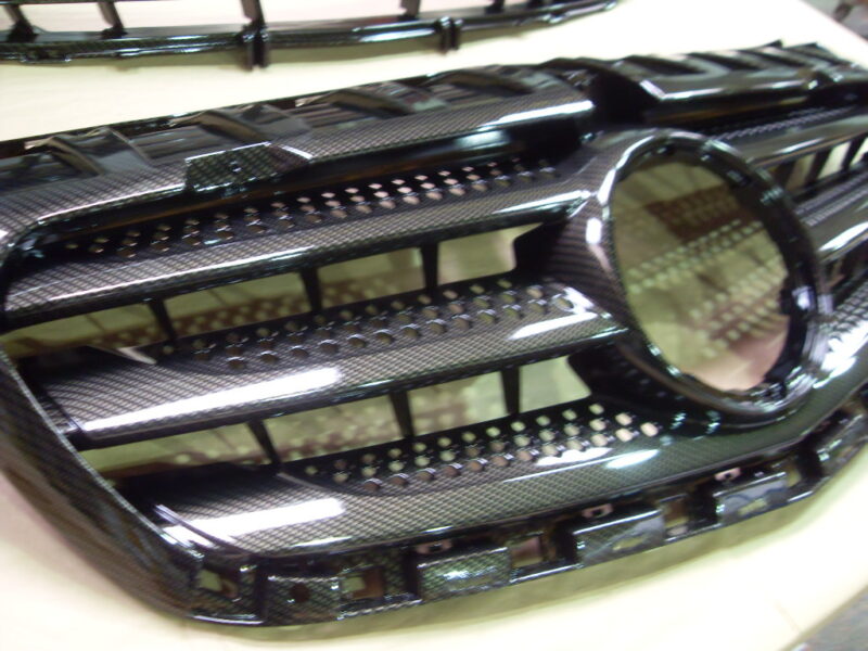 Mercedes radiator cover coated in carbon fibre hydrographic film painted black
