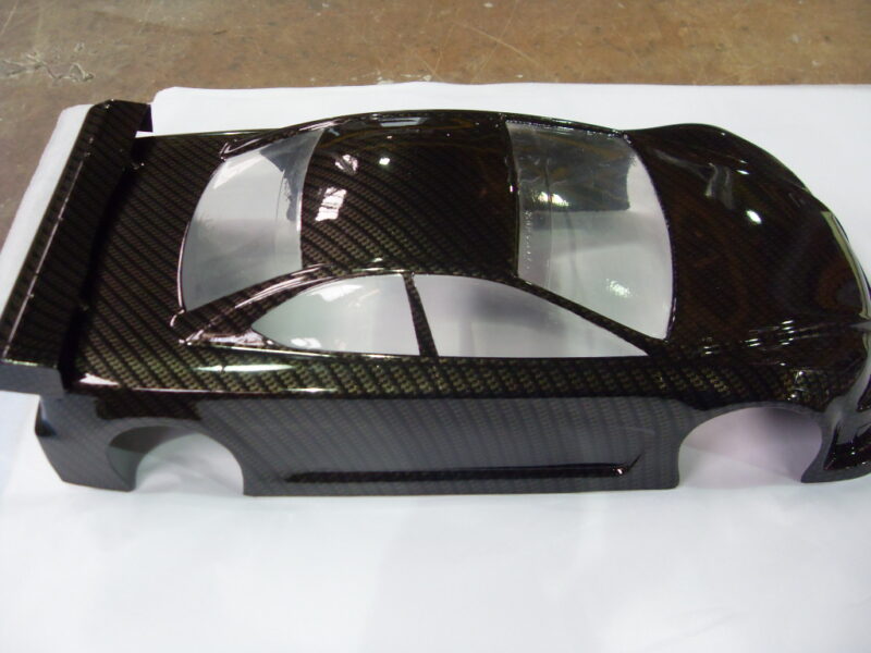 Car exterior model coated in carbon fibre hydrographic film painted black
