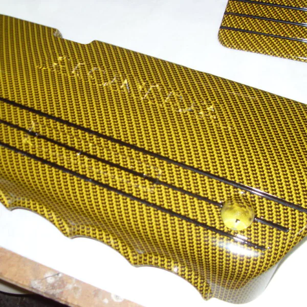 Honda engine elements coated in carbon fibre hydrographic film painted yellow