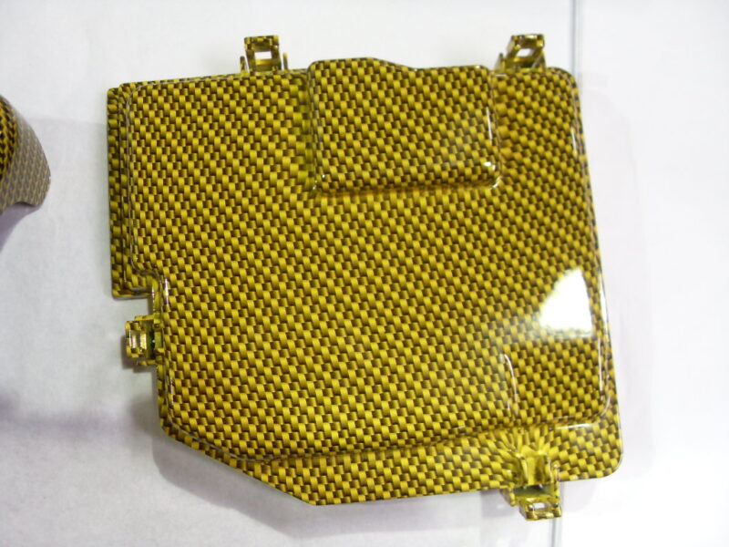 Honda engine elements coated in carbon fibre hydrographic film painted yellow