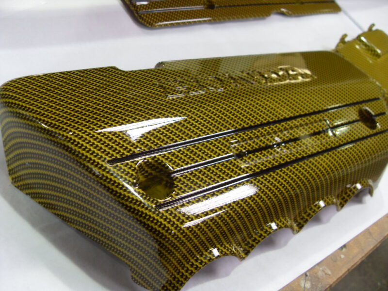 Honda engine elements coated in carbon fibre hydrographic film painted yellow