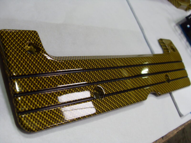 Honda engine elements coated in carbon fibre hydrographic film painted yellow