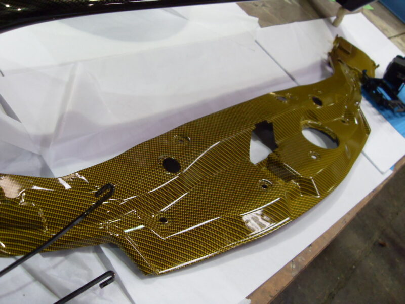 Honda engine elements coated in carbon fibre hydrographic film painted yellow