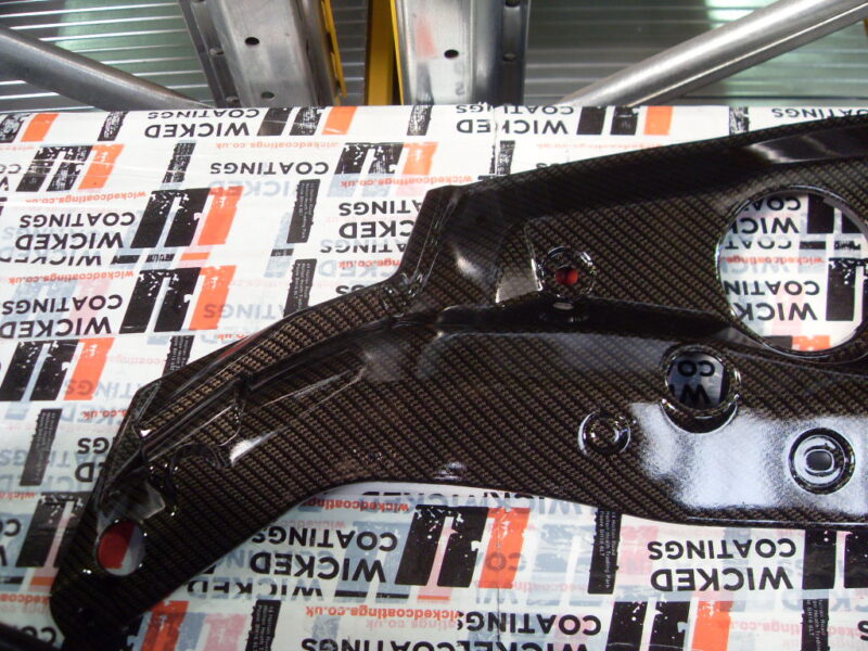 Honda engine parts coated in carbon fibre hydrographic film painted black