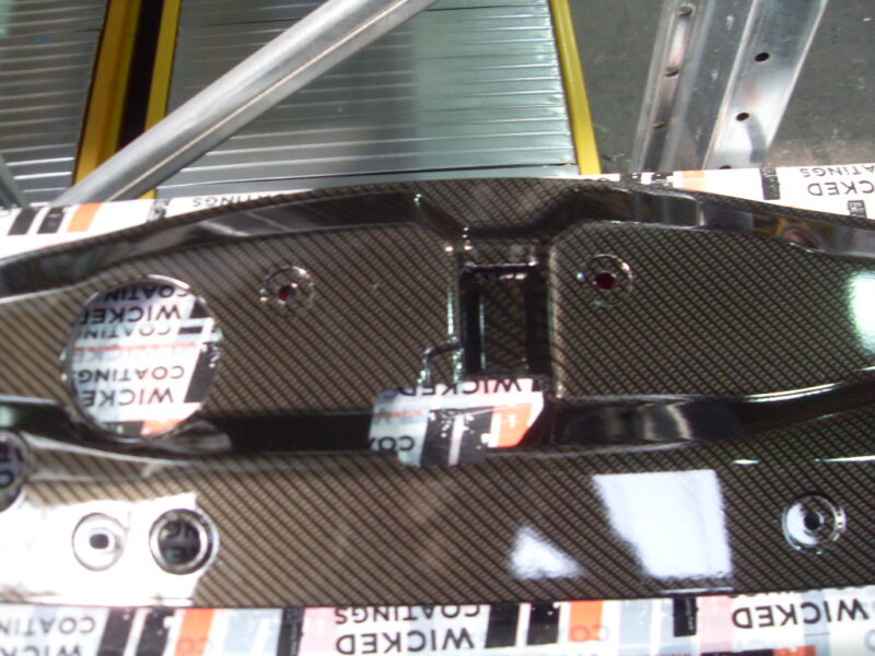 Honda engine parts coated in carbon fibre hydrographic film painted black