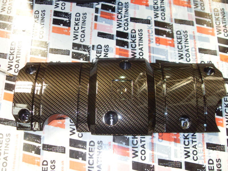 Honda engine parts coated in carbon fibre hydrographic film painted black