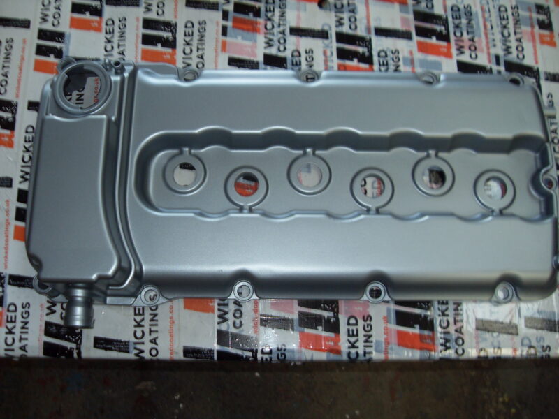 Car engine cover coated in metal hydrographic film