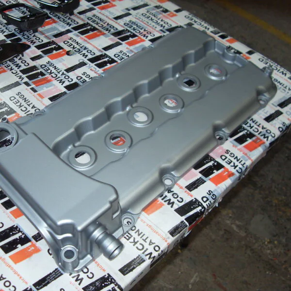 Car engine cover coated in metal hydrographic film
