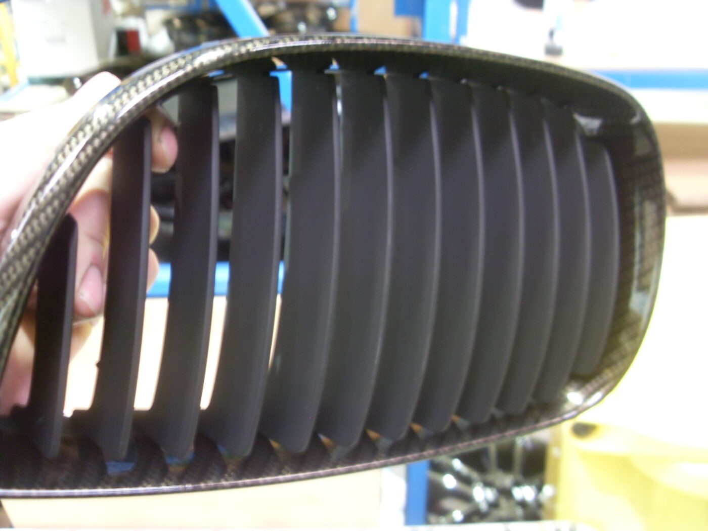 BMW radiator grill coated in carbon fibre hydrographic film painted black